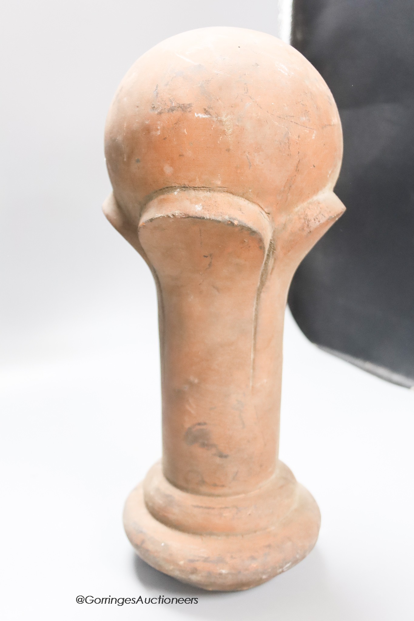 A terracotta finial, height 38cm